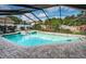 Enjoy the Florida lifestyle with this bright pool and spa combo in a screened enclosure at 2392 Hillcreek E Cir, Clearwater, FL 33759