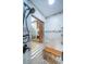 Luxury shower boasts a built-in bench, modern fixtures, glass partition, and designer tile at 2392 Hillcreek E Cir, Clearwater, FL 33759