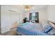 Bright bedroom featuring a window desk, a spacious closet, and ceiling fan at 2427 Twin Dr # 2, Sarasota, FL 34234