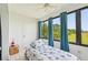 Bright sunroom/bedroom with large windows offering a natural view, and cool coastal accents at 2427 Twin Dr # 2, Sarasota, FL 34234