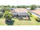 A beautiful home featuring a large screened in pool and overlooking a canal at 2679 Saddlewood Ln, Palm Harbor, FL 34685