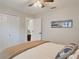 Cozy bedroom featuring an ensuite bath and modern decor at 2679 Saddlewood Ln, Palm Harbor, FL 34685