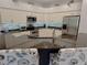 Well-equipped kitchen with granite countertops, stainless steel appliances, and ample cabinetry at 2679 Saddlewood Ln, Palm Harbor, FL 34685