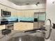 Kitchen featuring stainless steel appliances, granite counters, and tiled backsplash at 2679 Saddlewood Ln, Palm Harbor, FL 34685