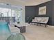 Bright living room with access to the lanai, tile floors, and contemporary decor at 2679 Saddlewood Ln, Palm Harbor, FL 34685