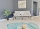Relaxing seating area with a turtle painting, neutral colors, and tile floors at 2679 Saddlewood Ln, Palm Harbor, FL 34685