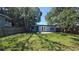 Well-maintained backyard featuring a light blue shed with french doors and privacy fence at 2825 16Th N Ave, St Petersburg, FL 33713