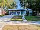 Charming single-story home featuring a well-maintained lawn and cozy front porch at 2825 16Th N Ave, St Petersburg, FL 33713