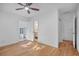 Bright bedroom with hardwood floors and multiple access doors for convenience at 3027 Burlington N Ave, St Petersburg, FL 33713