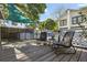 Outdoor deck with shaded seating area featuring dark wicker chairs and wooden flooring at 3027 Burlington N Ave, St Petersburg, FL 33713