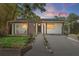 Charming home featuring a modern design with a covered porch and well-manicured front yard at 3027 Burlington N Ave, St Petersburg, FL 33713