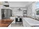 Spacious kitchen with marble backsplash, wood countertops, stainless steel appliances, and modern fixtures at 3027 Burlington N Ave, St Petersburg, FL 33713