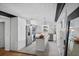 A modern kitchen is equipped with an island, stainless steel appliances, and white cabinets at 3027 Burlington N Ave, St Petersburg, FL 33713