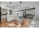 Open living room with hardwood floors and modern décor adjacent to a dining area at 3027 Burlington N Ave, St Petersburg, FL 33713