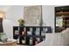 Stylishly decorated living room with built-in shelving, modern art, and a wine cooler at 3027 Burlington N Ave, St Petersburg, FL 33713