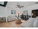 Bright living room featuring hardwood floors, neutral tones, and a cozy seating area at 3027 Burlington N Ave, St Petersburg, FL 33713