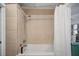 Tiled shower featuring a showerhead and white tub and shower curtain at 3027 Burlington N Ave, St Petersburg, FL 33713