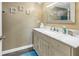 Neutral bathroom vanity with marble countertop, stylish decor and framed mirror at 3034 Mockingbird Ct, Clearwater, FL 33762
