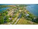 Scenic aerial view of the neighborhood, featuring waterfront access, lush greenery, and serene surroundings at 321 Shore E Dr, Oldsmar, FL 34677
