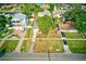 Aerial view of the property showcasing its well-manicured lawn, mature trees, and neighborhood at 321 Shore E Dr, Oldsmar, FL 34677