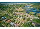 Stunning aerial view featuring a residential area with lakes, winding streets, and lush greenery at 321 Shore E Dr, Oldsmar, FL 34677