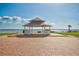 A gazebo overlooking the water, offering a peaceful and scenic retreat on a sunny day at 321 Shore E Dr, Oldsmar, FL 34677