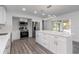 Stylish kitchen boasts stainless steel appliances, sleek cabinetry, and a center island with ample counter space at 321 Shore E Dr, Oldsmar, FL 34677