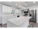 Modern kitchen with stainless steel appliances, a center island, and custom cabinets offering ample storage at 321 Shore E Dr, Oldsmar, FL 34677