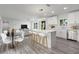Bright kitchen features stainless steel appliances, a large island, and an open layout to the living area at 321 Shore E Dr, Oldsmar, FL 34677