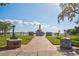 Park featuring a war memorial monument and lush landscaping overlooking a waterfront view at 321 Shore E Dr, Oldsmar, FL 34677