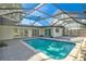 Sparkling pool with screened lanai and access from sliding glass doors at 321 Shore E Dr, Oldsmar, FL 34677
