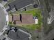 Aerial view showing the property line, brown roof, and green backyard at 34135 White Fountain Ct, Wesley Chapel, FL 33545