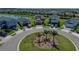 Aerial view of a two-story home on a cul-de-sac near a pond at 34135 White Fountain Ct, Wesley Chapel, FL 33545