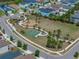 A lush community park features playground equipment, basketball court and walking paths at 34135 White Fountain Ct, Wesley Chapel, FL 33545