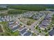 An aerial view showcasing a community park with playground equipment and walking paths at 34135 White Fountain Ct, Wesley Chapel, FL 33545
