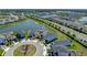 Beautiful aerial view of a home in a well-maintained community near a tranquil lake at 34135 White Fountain Ct, Wesley Chapel, FL 33545