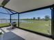 Enjoy the serene backyard lake view from the screened-in lanai with a barbecue grill at 34135 White Fountain Ct, Wesley Chapel, FL 33545