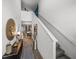 Hallway featuring modern decor and a view into the living area at 34135 White Fountain Ct, Wesley Chapel, FL 33545