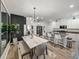 Spacious kitchen with island seating, stainless appliances, and an adjacent dining area at 34135 White Fountain Ct, Wesley Chapel, FL 33545