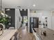Bright open-concept kitchen features stainless steel appliances and convenient laundry area at 34135 White Fountain Ct, Wesley Chapel, FL 33545