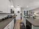 Bright kitchen with island seating, stainless steel appliances, and open layout at 34135 White Fountain Ct, Wesley Chapel, FL 33545
