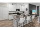 Kitchen featuring an island with seating, stainless steel appliances, and modern finishes at 34135 White Fountain Ct, Wesley Chapel, FL 33545