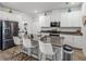Well-equipped kitchen with stainless steel appliances, island, and ample cabinet space at 34135 White Fountain Ct, Wesley Chapel, FL 33545