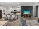 Open concept living and kitchen area with breakfast bar and modern decor at 34135 White Fountain Ct, Wesley Chapel, FL 33545