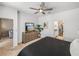 Main bedroom features neutral carpet, a ceiling fan, and hallway views at 34135 White Fountain Ct, Wesley Chapel, FL 33545