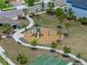 An aerial view showcasing the neighborhood park with playground and basketball court at 34135 White Fountain Ct, Wesley Chapel, FL 33545