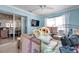 Bedroom with light blue walls and sliding glass doors at 3957 Tarpon Pointe Cir, Palm Harbor, FL 34684
