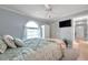 Light-filled bedroom features a built-in closet and a large window for natural light at 3957 Tarpon Pointe Cir, Palm Harbor, FL 34684