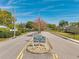Pristine Pointe community entrance sign flanked by mature landscaping on a sunny day at 3957 Tarpon Pointe Cir, Palm Harbor, FL 34684