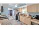 Bright kitchen with stainless steel appliances, light cabinets, and granite countertops at 3957 Tarpon Pointe Cir, Palm Harbor, FL 34684